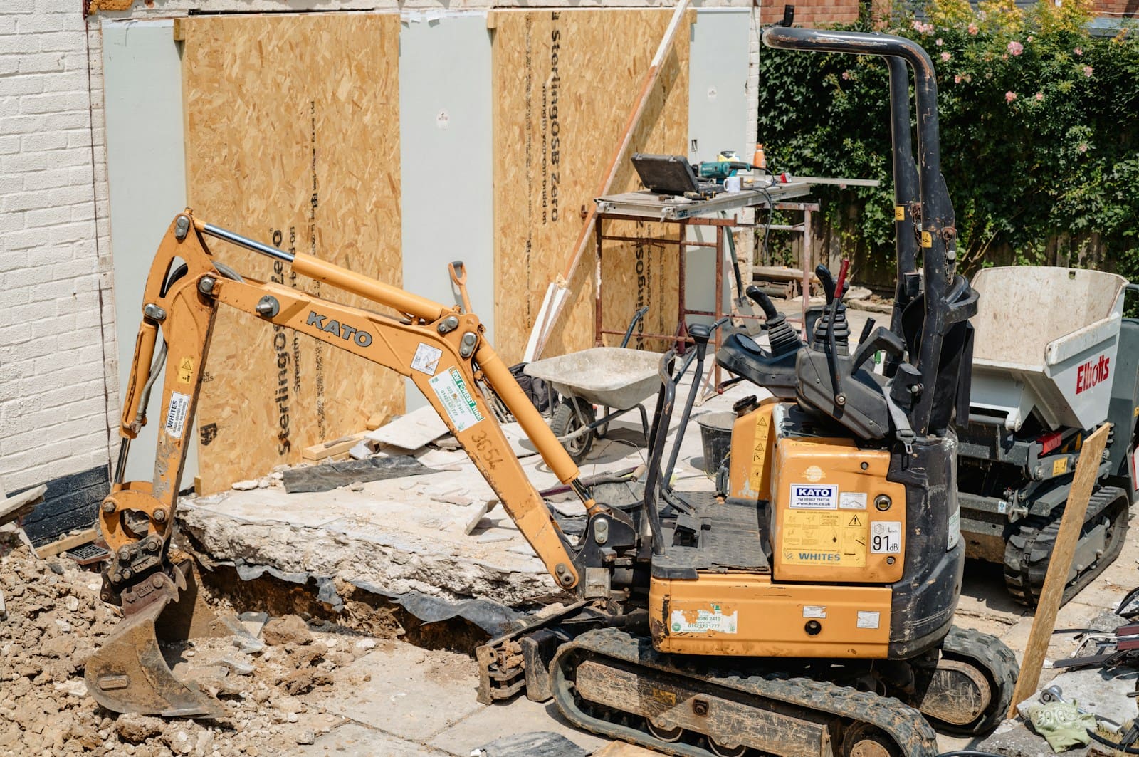 A mini digger working on a building site